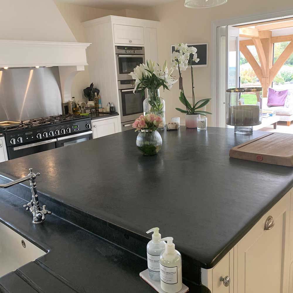 A Black Slate Kitchen Worktop in a Predominantly White Kitchen