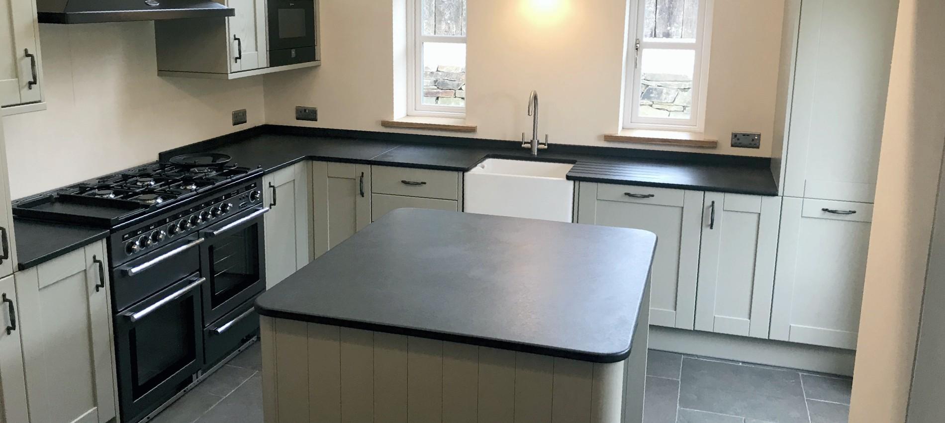 Modern kitchen with slate worktops and island