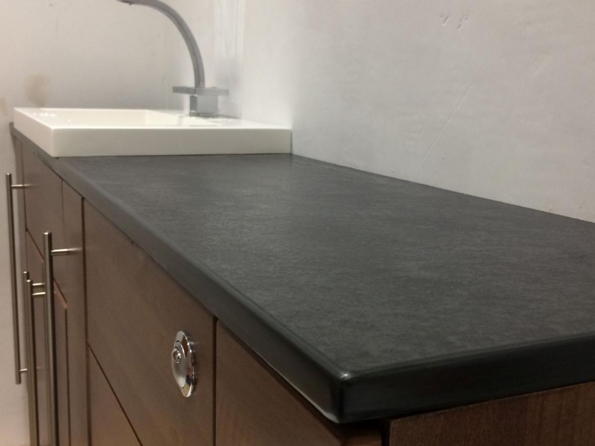 custom made sink surround in dark grey slate