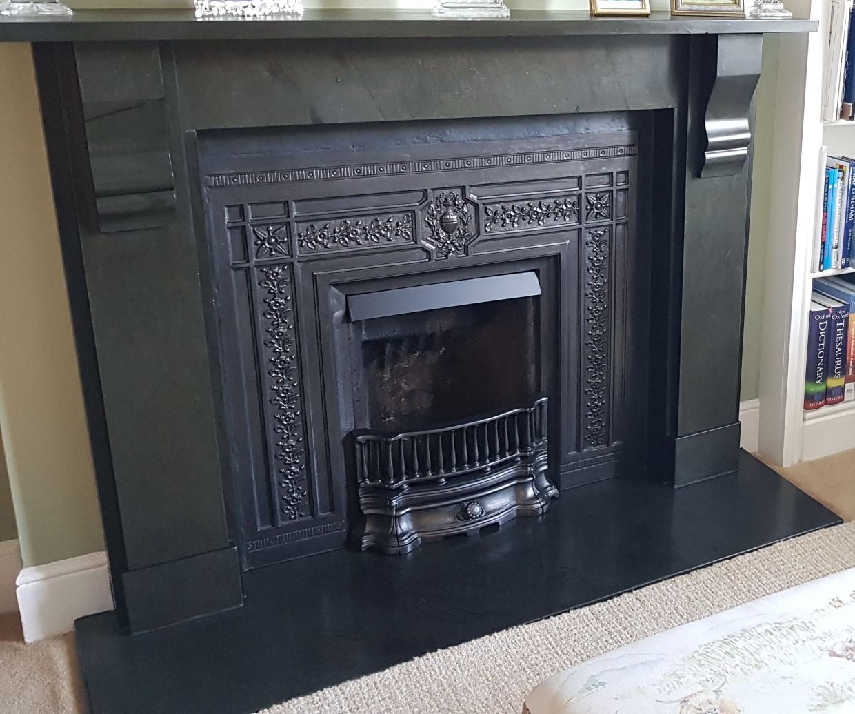 the custom cut slate fire hearth fitted around the open fire