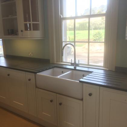Double section Belfast sink with two sided sink surround
