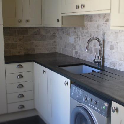 utillity room slate worktops with sink and washing machine underneath