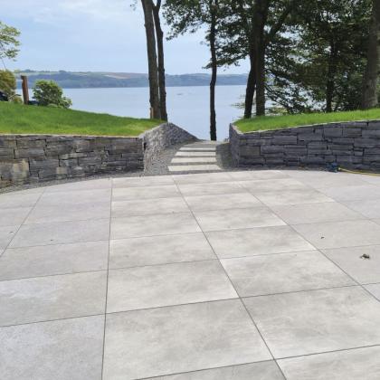 Beautiful patio in Masterstone silver Porcelain leading to a beach
