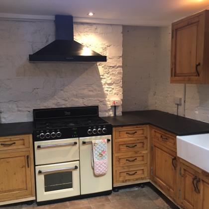 Traditional cottage kitchen with aga, wood and slate cooker surrounds