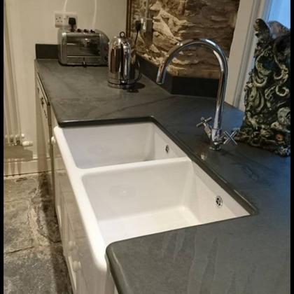double belfast sink with slate worktop and drainage grooves