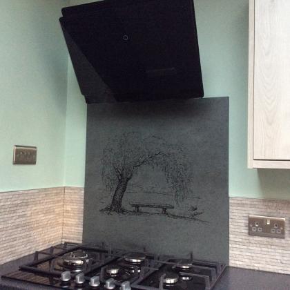 Cooker splashback in slate with custom engraving of a tree