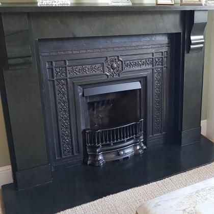 Victorian slate fire hearth with exact cuts after fitting in lounge