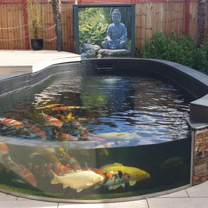 koi carp pond with slate capping and glass front custom built