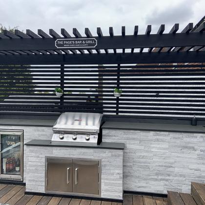 outdoor bbq and bar with slate worktop in a custom built outdoor kitchen