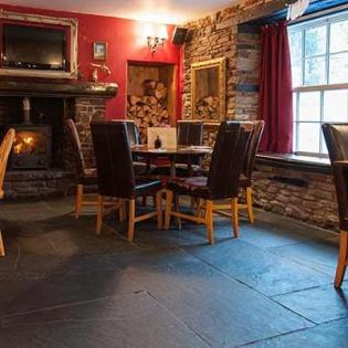 Traditional flagstones in a restaurant providing a fough natural flooring with an authentic feel.