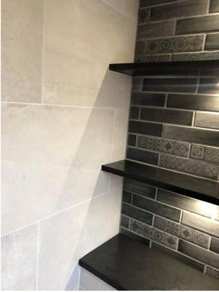 slate shelves in different sizes in a contemporary and modern lounge