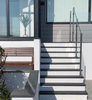 architect designed slate steps with glass hand rails