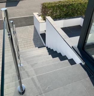 looking down on external contemporary slate steps with glass side