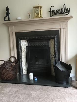 Victotrian fireplace with raised hearth and traditional 19th century fireplace surround