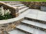 lime ash ashlar limestone steps in a garden with a patio and natural stone