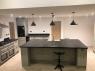 Breakfast bar in a modern kitchen with a slate work surface