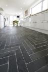 patterned slate cooble styled flooring in a contemporary kitchen