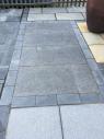 Polished slate paving in dark grey for a patio