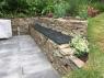 garden slate bench set on stone