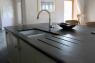 slate kitchen sink worktop with Belfast sink with drainage runners cut in the slate