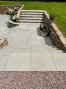 garden patio and steps with limestone slabs and stone walls