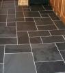 light and dark grey slate floor tiles with natural stone colouring in a mixed pattern