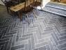 Restaurant floor by table with cobbles in natural slate.