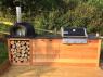 Full custom made outdoor kitchen with slate bbq and oven from Ardosia