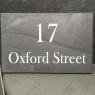 Street sign for a house engraved in slate