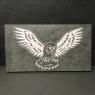 owl engraved onto slate